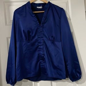 Ricki’s blue silky blouse